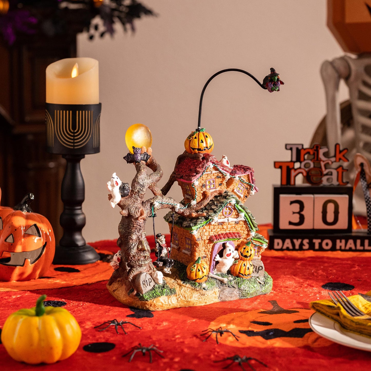 Valery Madelyn Halloween Decorations, Lighted Halloween Village Houses with Music and LED Lights, Resin Spooky Town Flying Witch and Haunted House for Home and Party Table Desk Mantel, 12 Inch